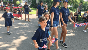 Ivywood families walking in a 4th of July parade