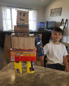 3rd Grade student with Robot made out of recyclables