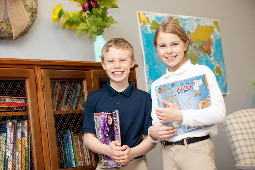 Ivywood students holding books