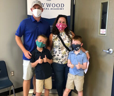 Family wearing masks ready for the first day of school!